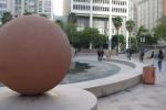 Hikers explore the historically layered and geometrically dominated open space of Pershing Square.